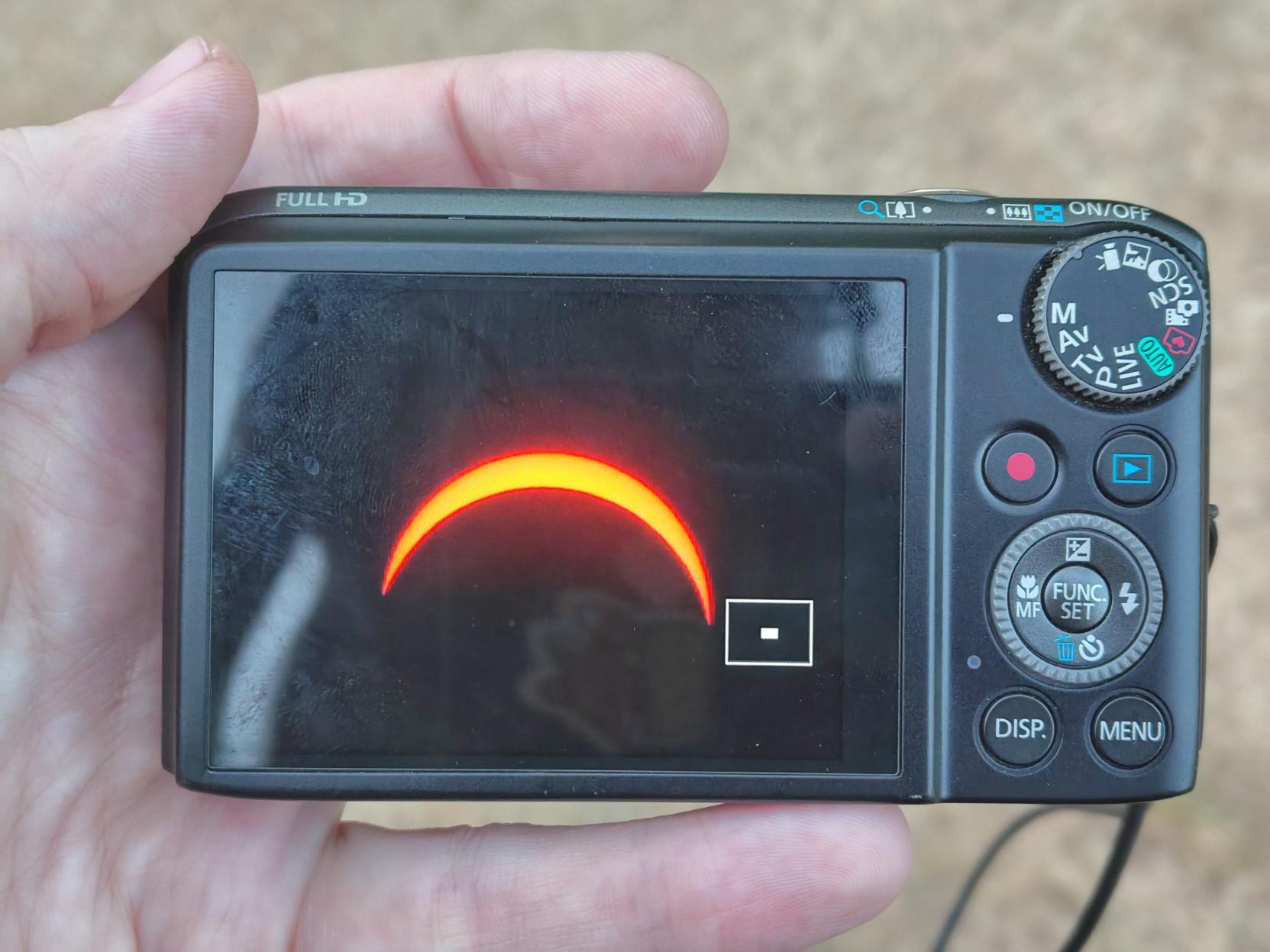 Partial solar eclipse (90% or so), photo taken from a camera screen.